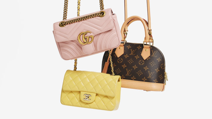 A Gucci Marmont, a Chanel Quilted Double Flap, and a Louis Vuitton Alma hanging from the top of the frame.