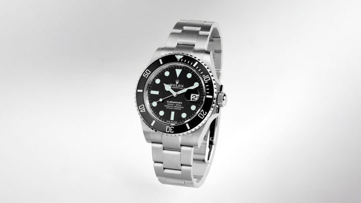 Rolex Submariner Date stainless steel watch with a black dial and matching black ceramic bezel