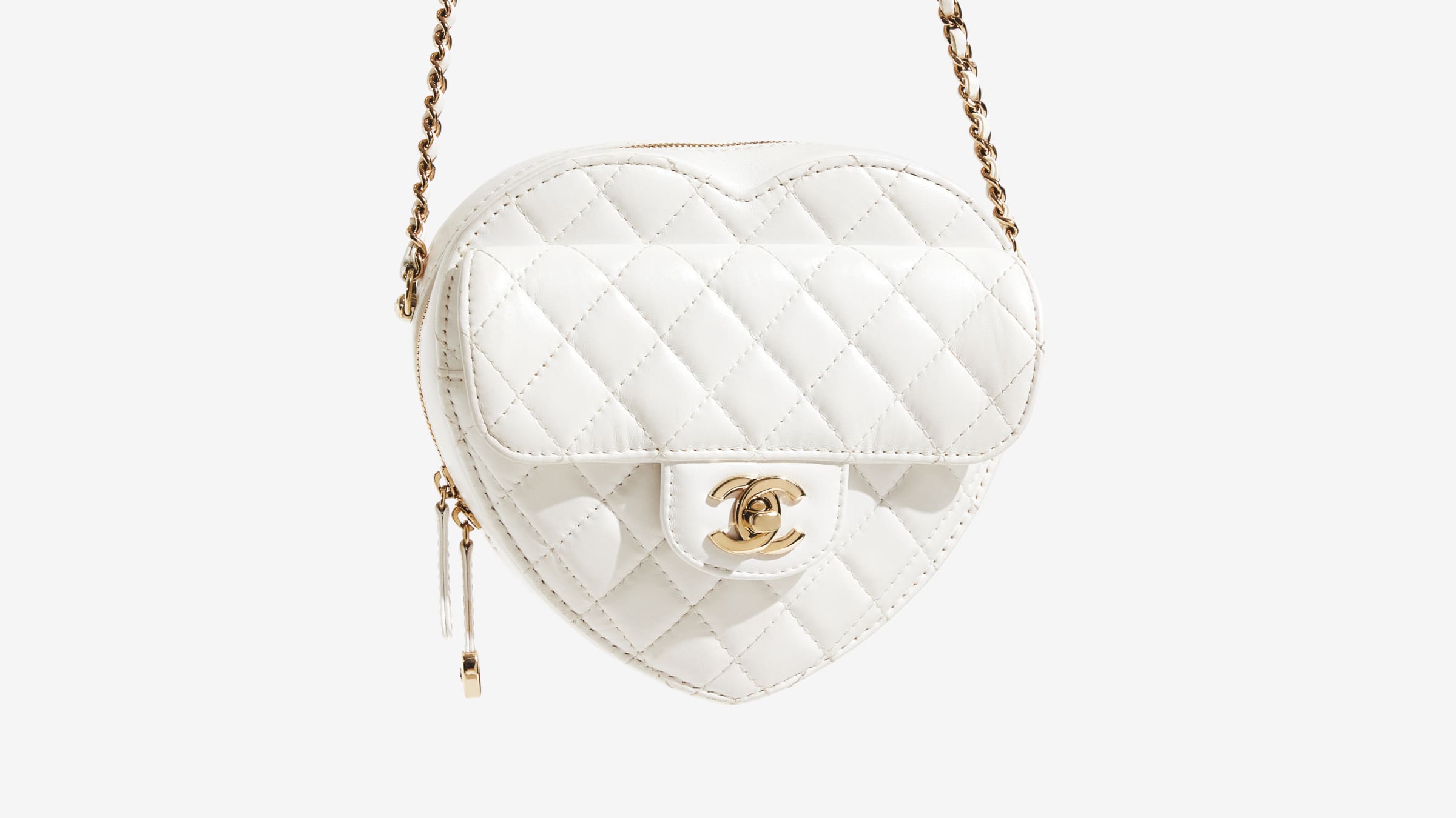 A dangling Chanel Lambskin Quilted CC In Love Heart Bag in White