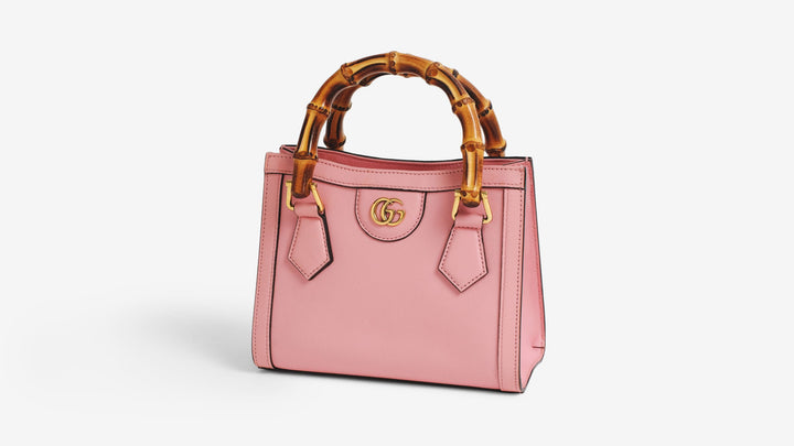 A pink Gucci Diana tote bag