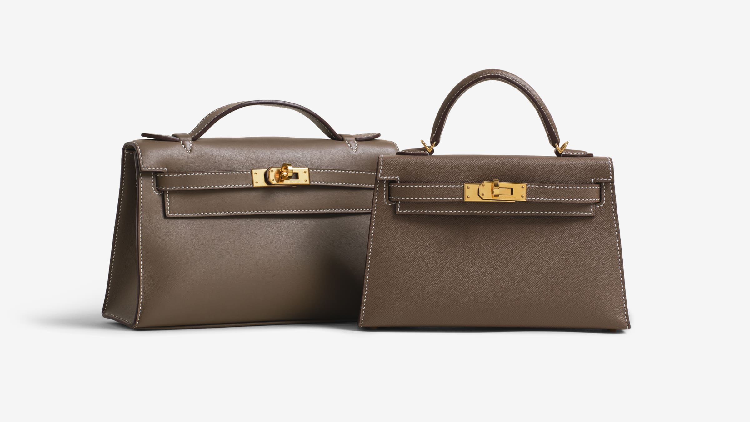A Kelly Pochette next to a Mini Kelly