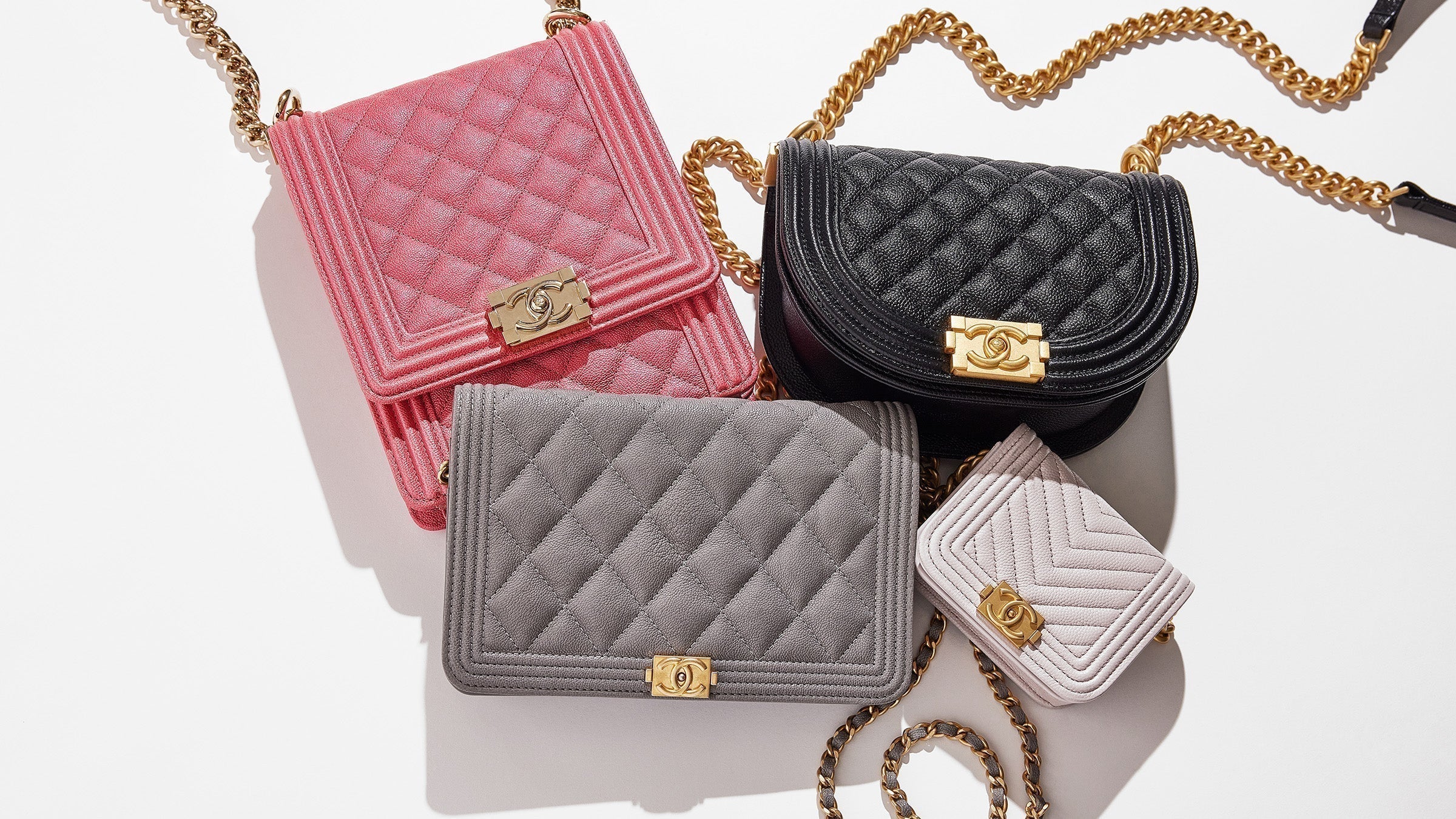 studio image on white of chanel boy bags grouped together FASHIONPHILE