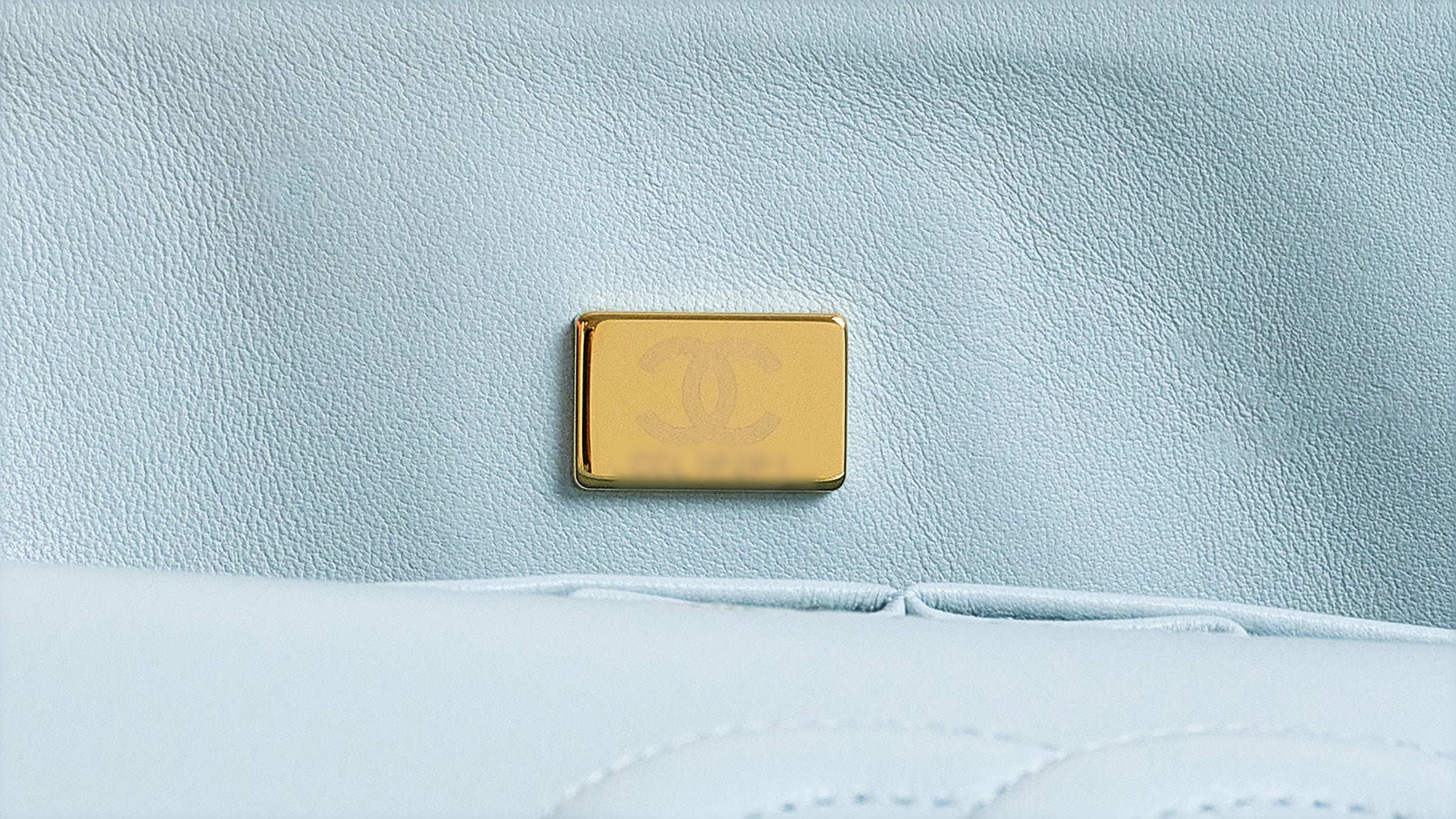 Close-up of a blurred out Chanel metal plate