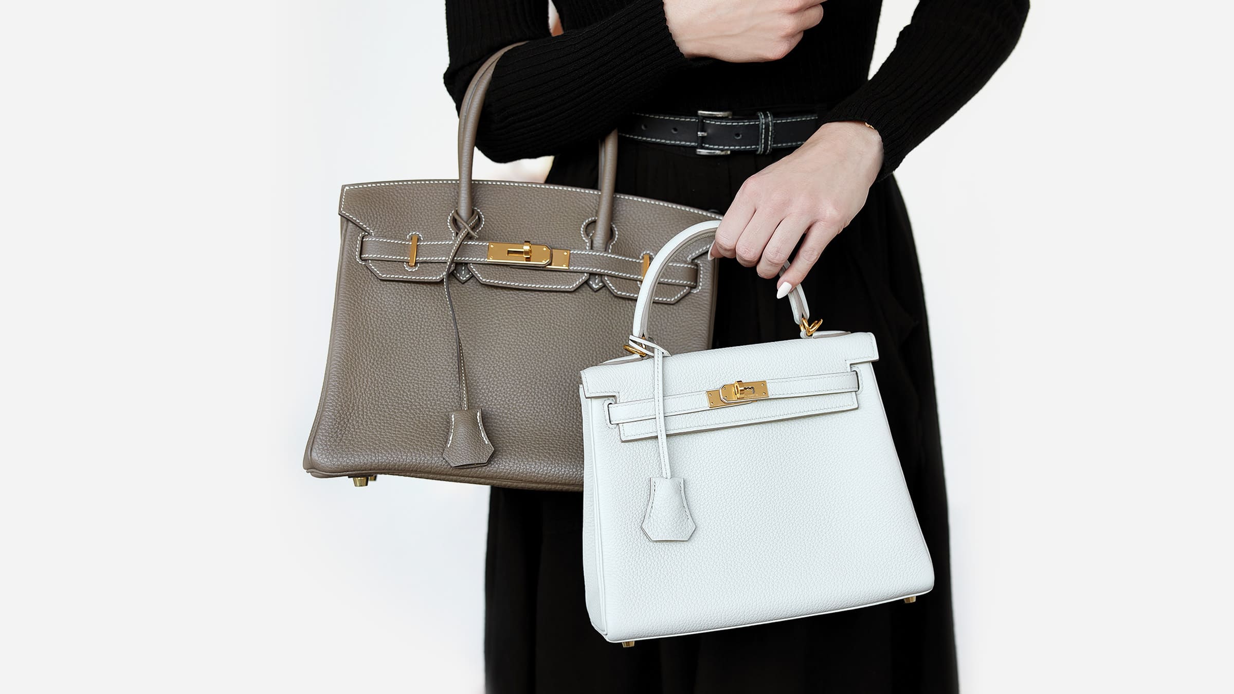 model comparing an hermes birkin and hermes kelly together side by side by FASHIONPHILE