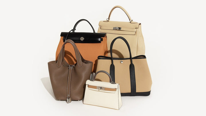 studio image of beige Hermes bags grouped together on white background FASHIONPHILE