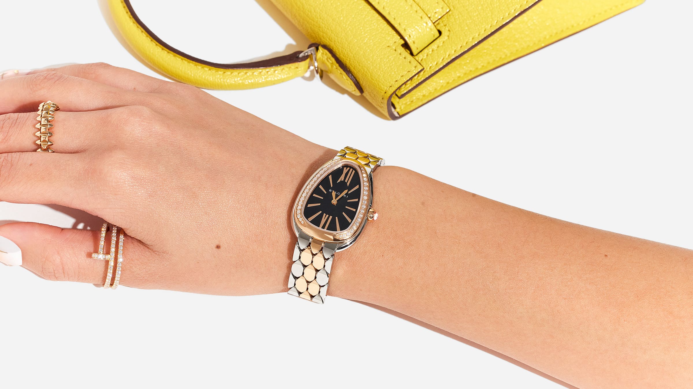 styling the bulgari seduttori watch with cartier jewelry and an hermes kelly bag by FASHIONPHILE