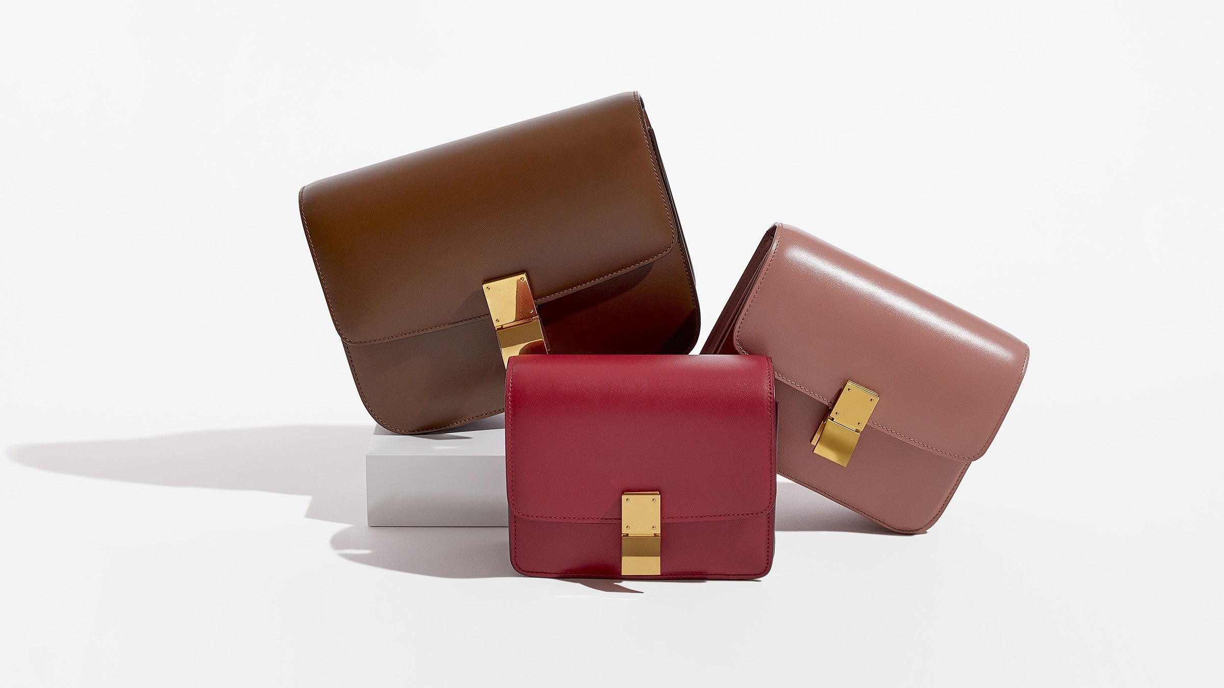 this is an image of all the celine classic box flap bags grouped together to compare size by fashionphile