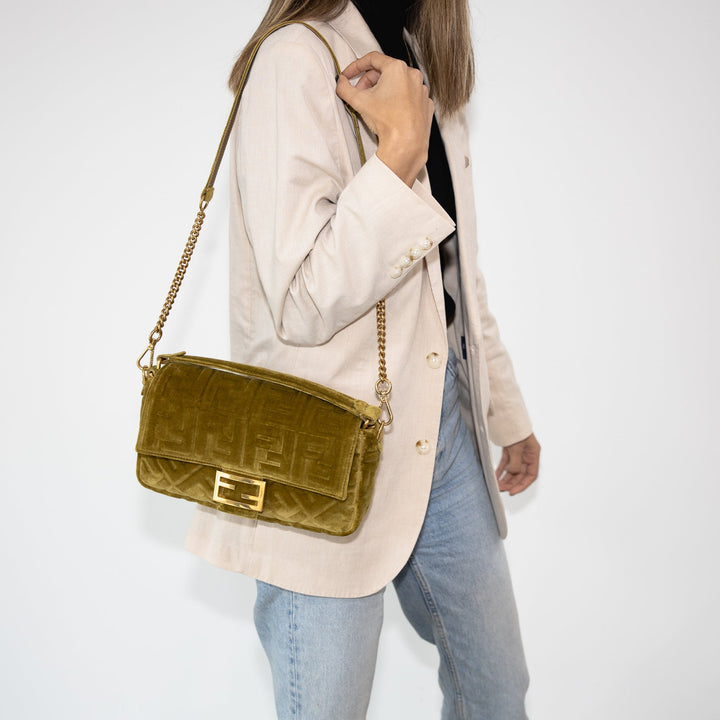 Woman carrying a velvet Fendi Baguette