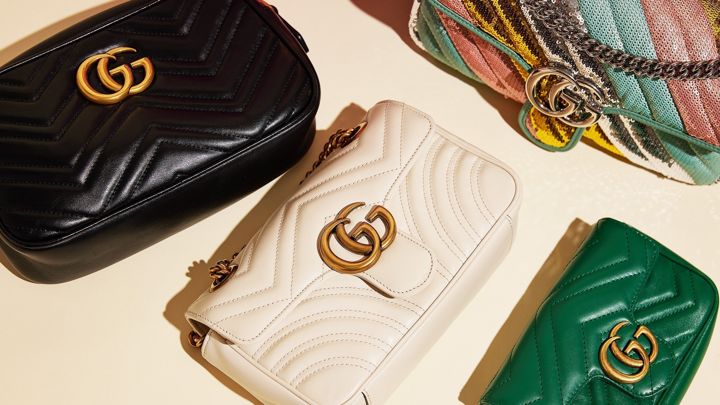 studio image of gucci handbags grouped together FASHIONPHILE