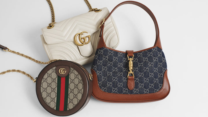 Photo of a Gucci Jackie, a Gucci Marmont, and a Gucci Ophidia centered in the frame