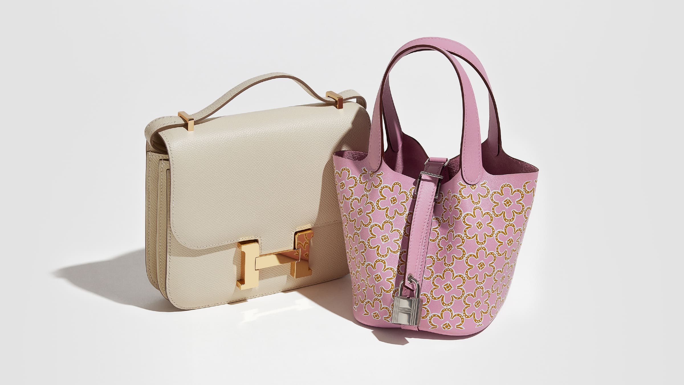studio image of hermes constance and hermes picotin bags grouped together