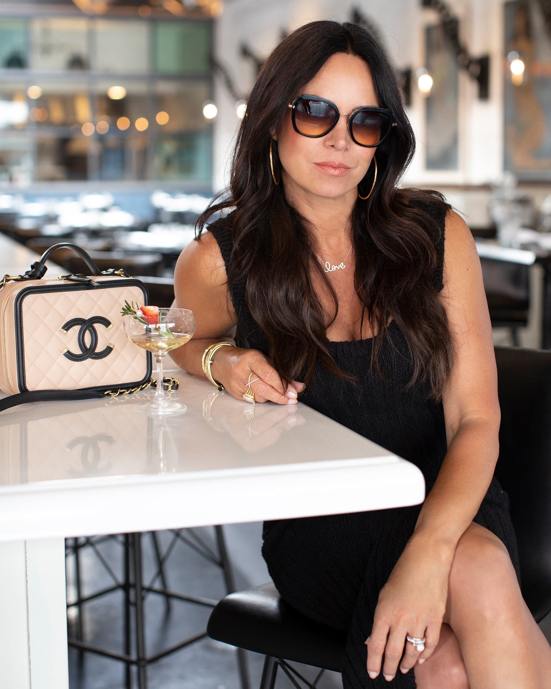 Lifestyle image of Chantelle Malarkey with her Chanel Vanity Case from FASHIONPHILE