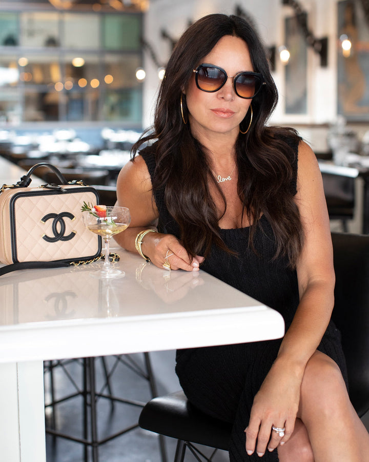 Lifestyle image of Chantelle Malarkey with her Chanel Vanity Case from FASHIONPHILE