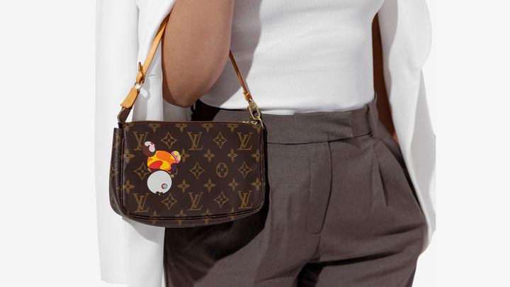 model wearing a limited edition louis vuitton monogram pochette accessories on her arm by fashionphile