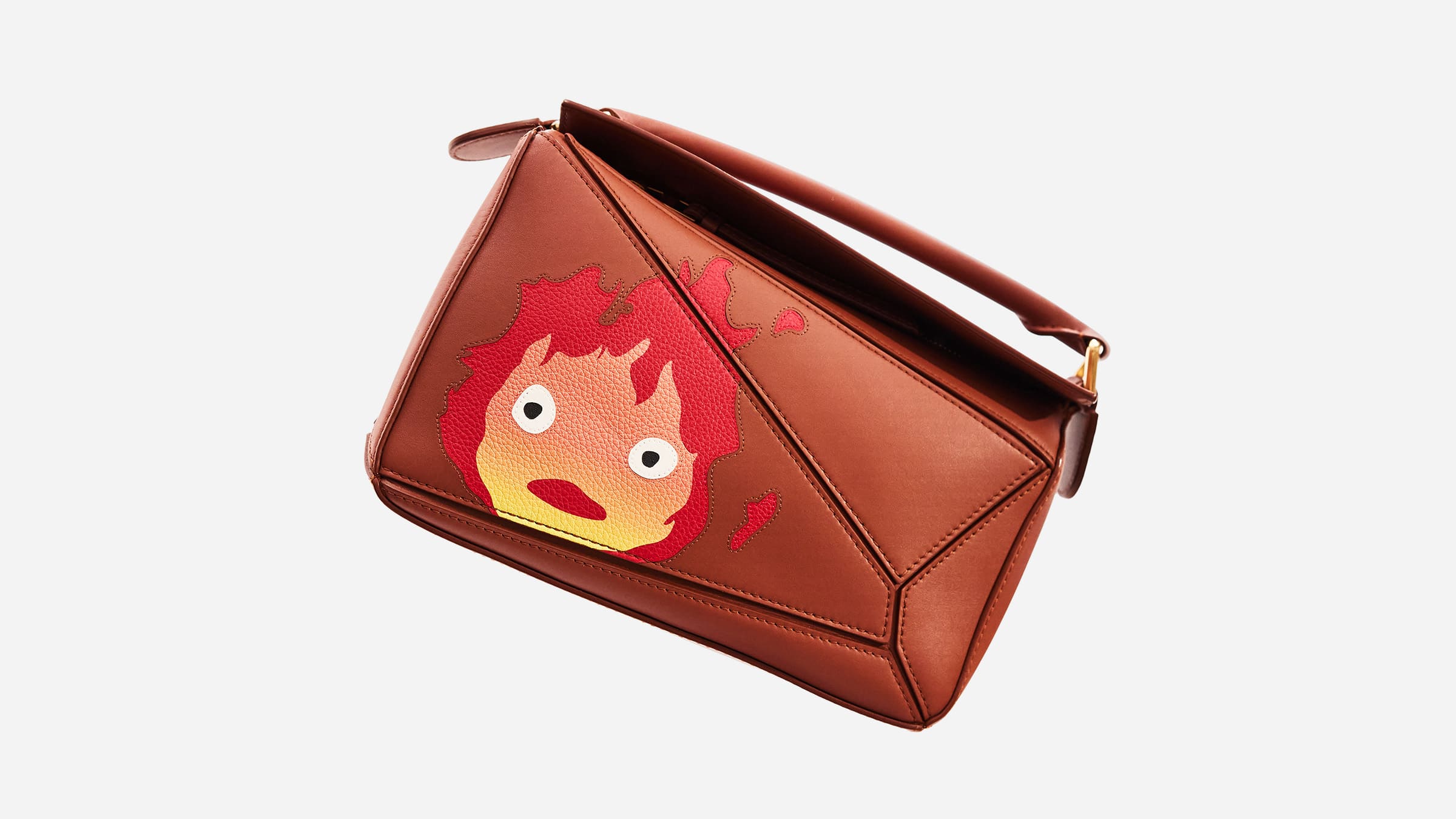image of loewe and howl's moving castle puzzle bag in brown by FASHIONPHILE