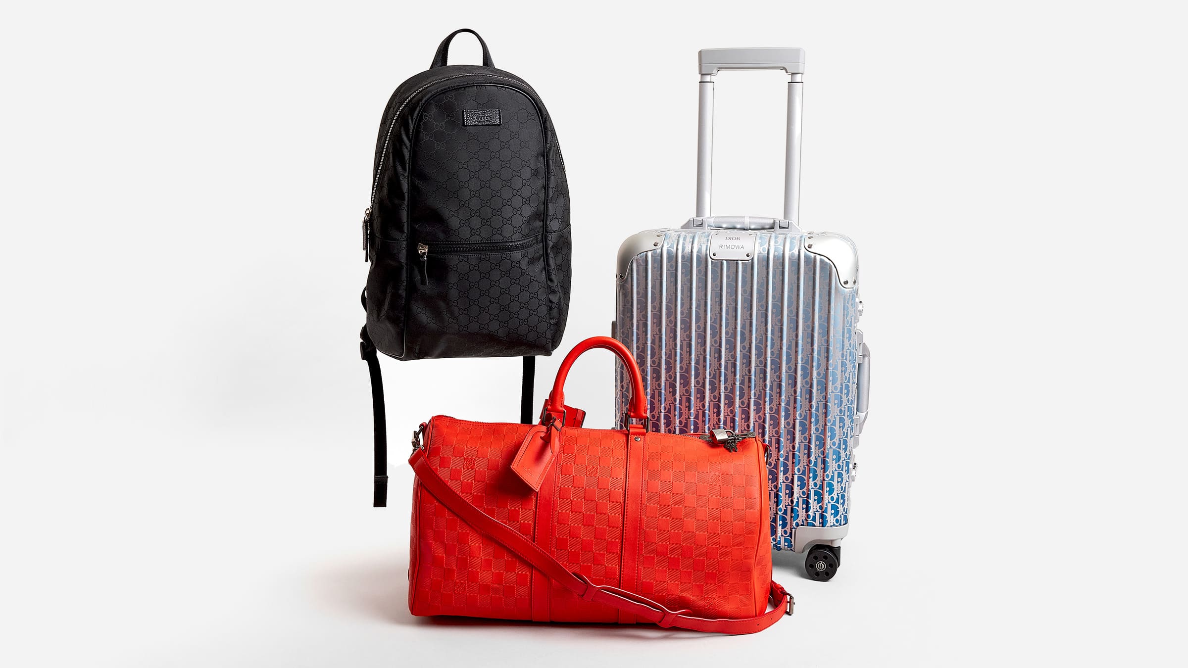 image of travel bags including backpacks, duffel bags, and suitcases by FASHIONPHILE