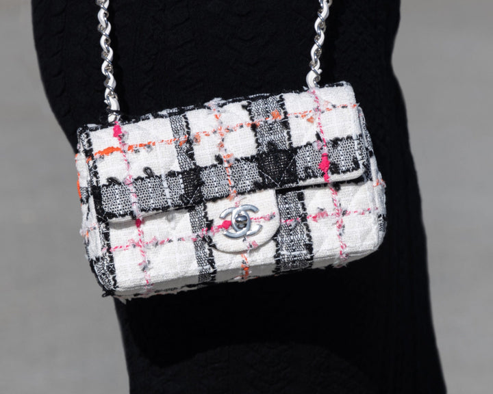 lifestyle image of model wearing chanel tweed handbag FASHIONPHILE