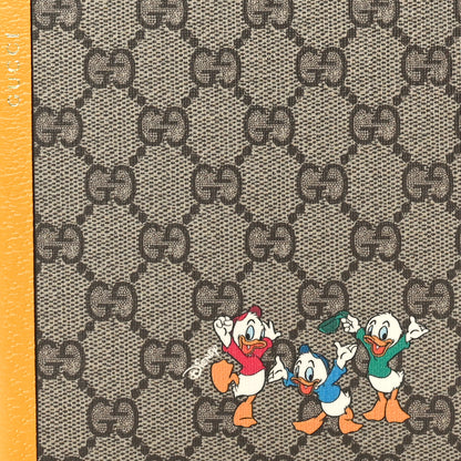 Gucci X DISNEY GG Supreme Monogram Textured Dollar Calfskin Donald Duck Notebook Beige Ebony Yellow 7 of 7