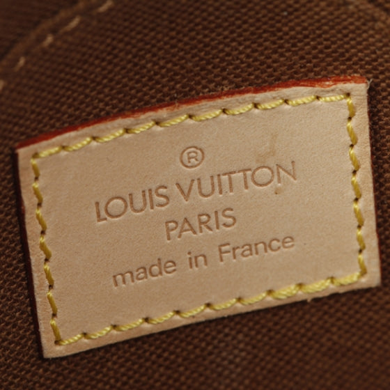 Monogram Mini Ellipse Wristlet Clutch