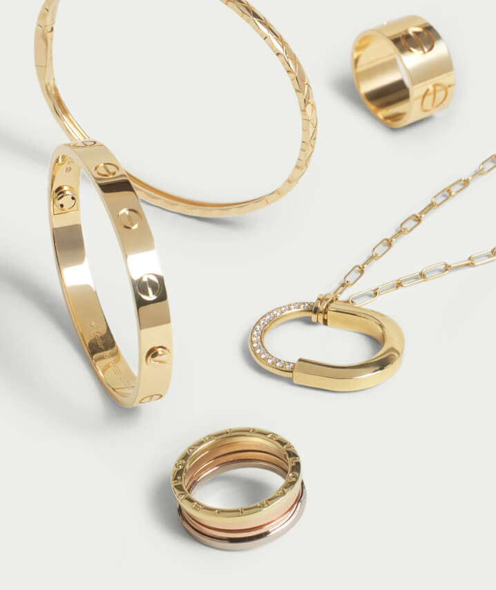 one yellow gold Cartier Love bracelet, one yellow gold Chanel Coco bracelet, one mixed metal Bulgari ring, one yellow gold Cartier Love ring, and one yellow gold Tiffany Lock necklace.